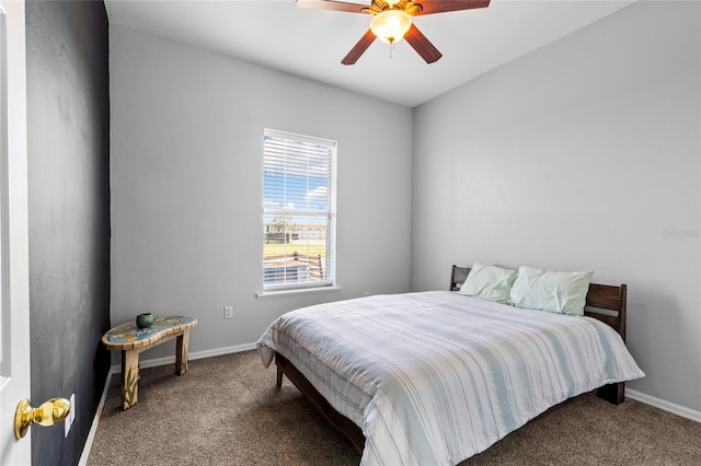 carpeted bedroom with a ceiling fan and baseboards