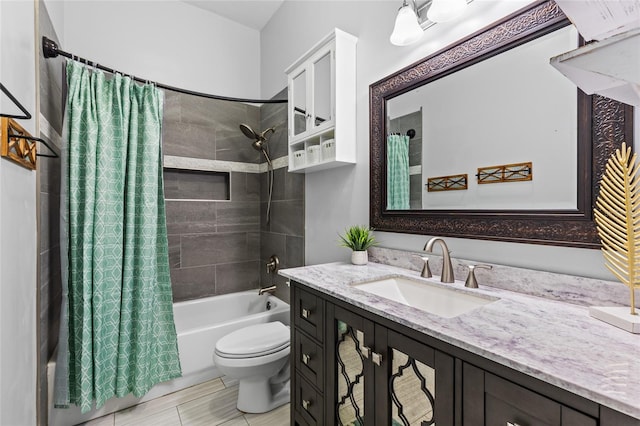 full bathroom with vanity, shower / bath combination with curtain, and toilet