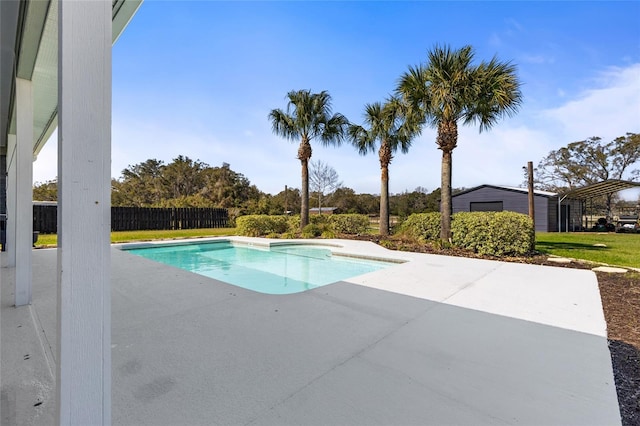 view of pool featuring a fenced in pool, a patio area, an outdoor structure, and fence