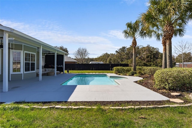 view of swimming pool with a ceiling fan, a fenced in pool, fence, and a patio