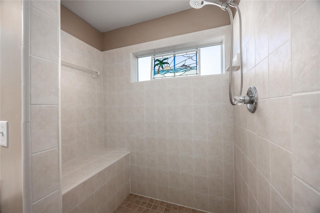 full bath featuring tiled shower