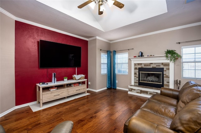 living room featuring a wealth of natural light, ceiling fan, baseboards, and hardwood / wood-style floors