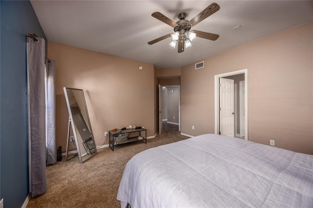 carpeted bedroom with a ceiling fan, baseboards, and visible vents