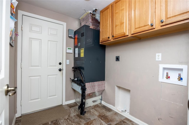 laundry area featuring cabinet space, hookup for an electric dryer, hookup for a washing machine, and baseboards