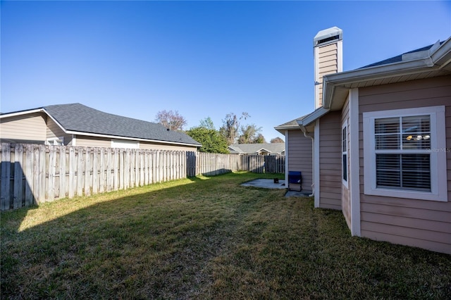 view of yard with a fenced backyard