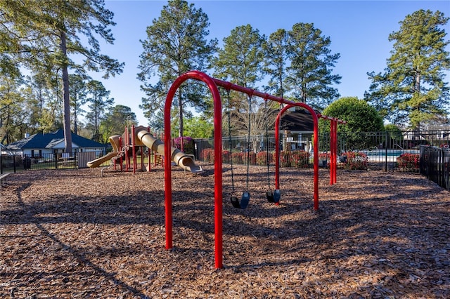 community jungle gym featuring fence