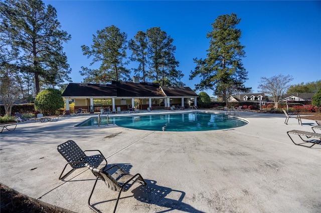 pool with a patio