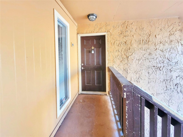 entrance to property featuring stucco siding