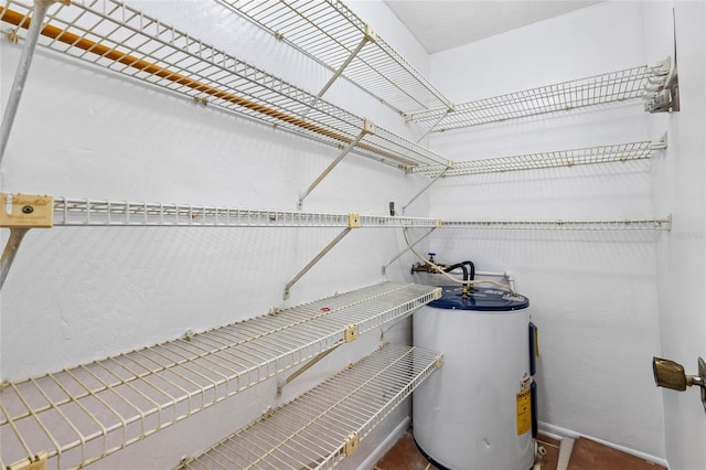 utility room with water heater