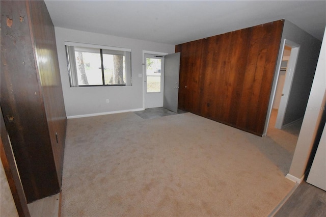 unfurnished room featuring carpet