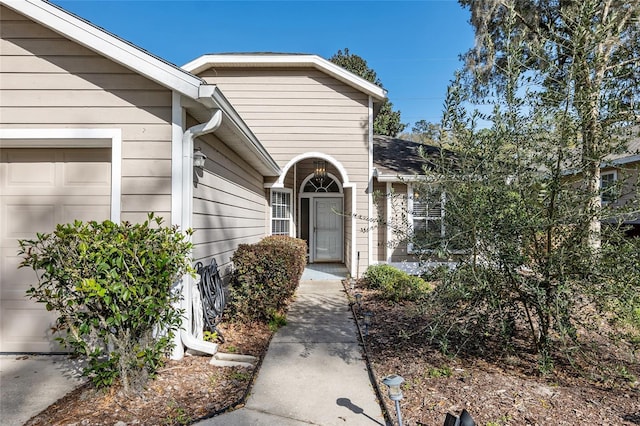 property entrance with a garage