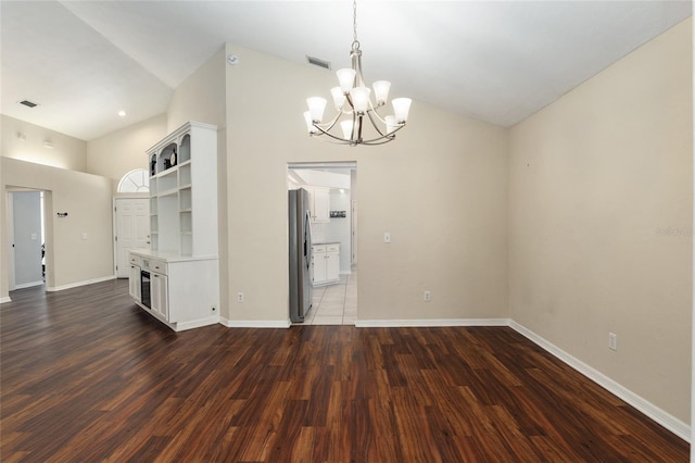 unfurnished dining area featuring wood finished floors, visible vents, and baseboards