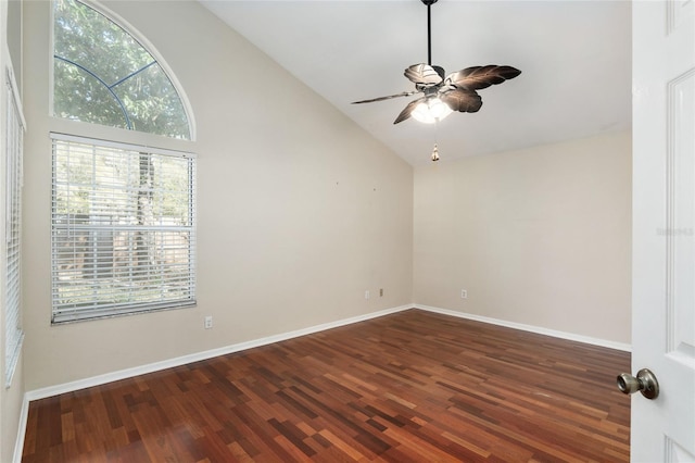 spare room featuring high vaulted ceiling, ceiling fan, baseboards, and wood finished floors