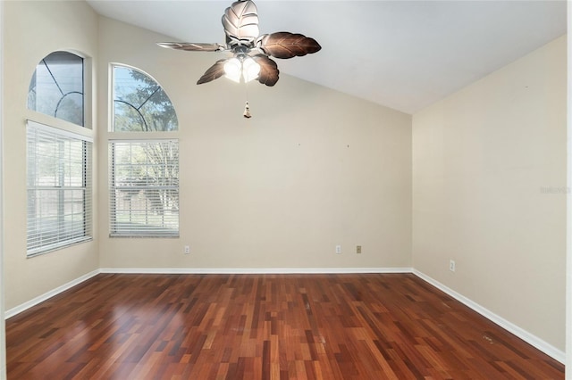 spare room featuring ceiling fan, high vaulted ceiling, wood finished floors, and baseboards