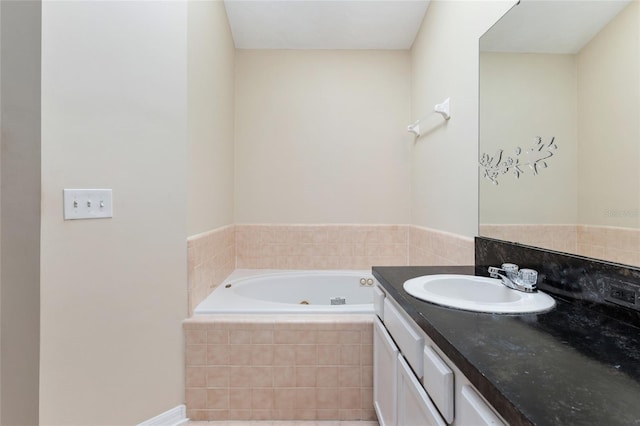 full bathroom featuring vanity and a whirlpool tub