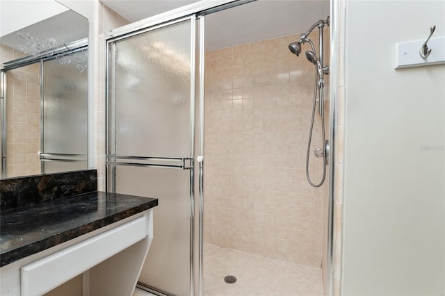 full bath featuring a shower stall and vanity