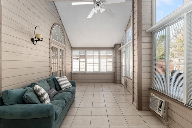 sunroom featuring lofted ceiling and ceiling fan