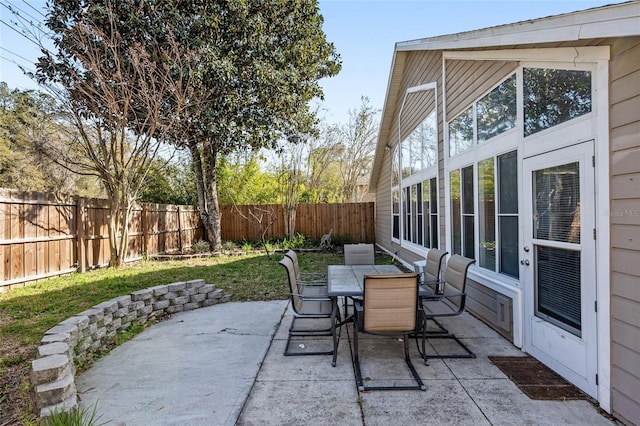 view of patio / terrace with outdoor dining space and a fenced backyard