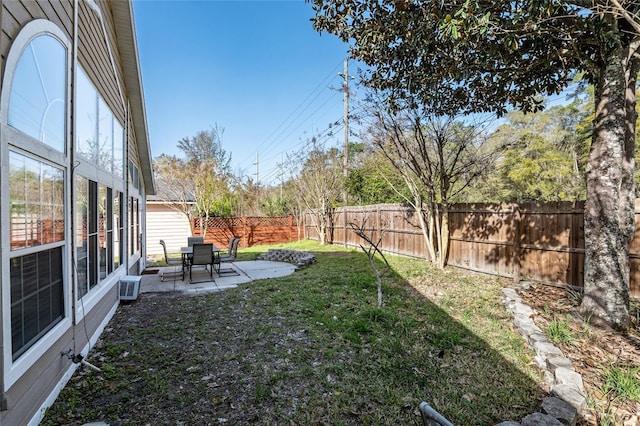 view of yard featuring a patio area and a fenced backyard