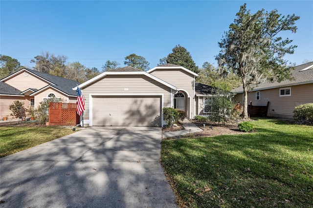 single story home featuring a garage, concrete driveway, and a front yard