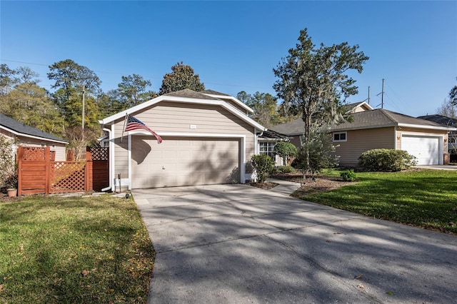 ranch-style home featuring concrete driveway, a front lawn, and fence