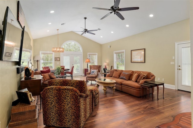 living area with dark wood finished floors, recessed lighting, french doors, and high vaulted ceiling