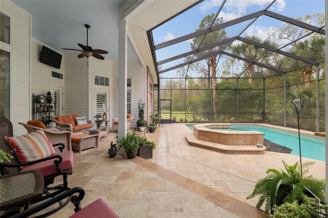 pool with a patio area, an in ground hot tub, a lanai, and a ceiling fan