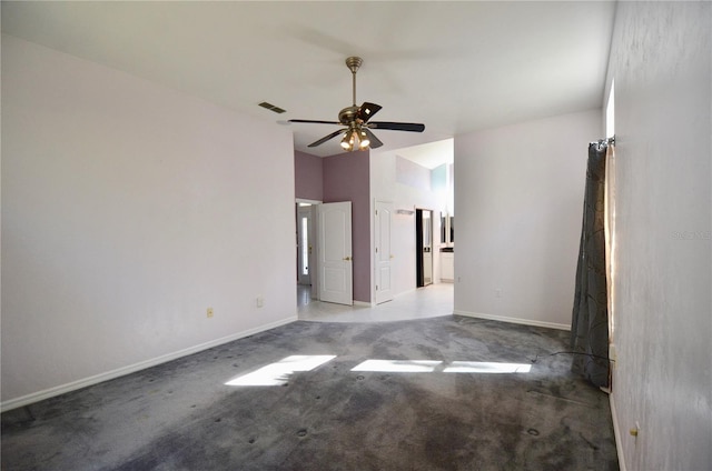 carpeted empty room featuring visible vents, baseboards, lofted ceiling, and ceiling fan