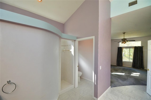 bathroom featuring visible vents, a shower stall, toilet, vaulted ceiling, and marble finish floor