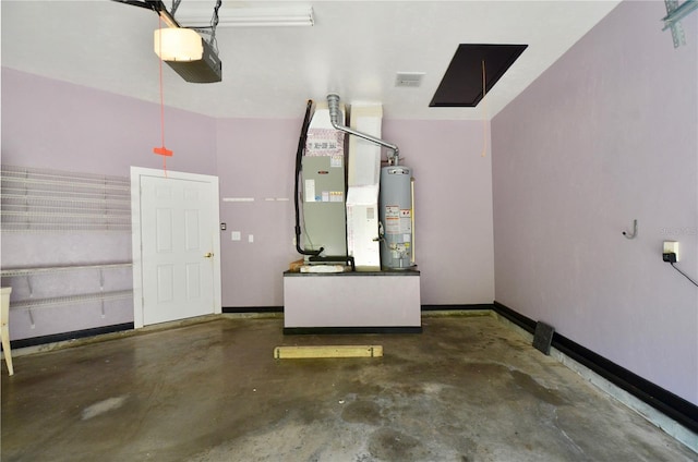 parking deck featuring visible vents, heating unit, a garage door opener, water heater, and baseboards