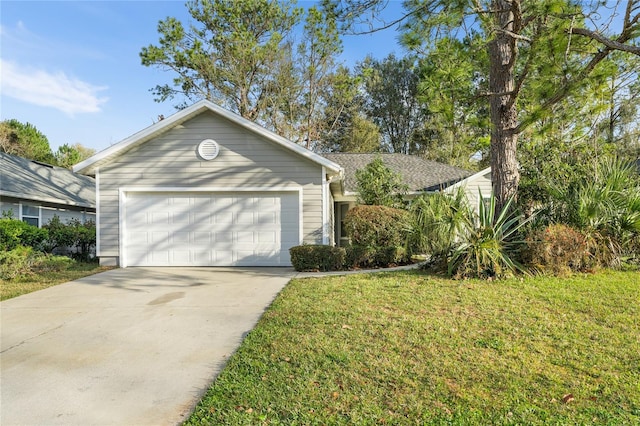 ranch-style house with a garage, concrete driveway, and a front lawn