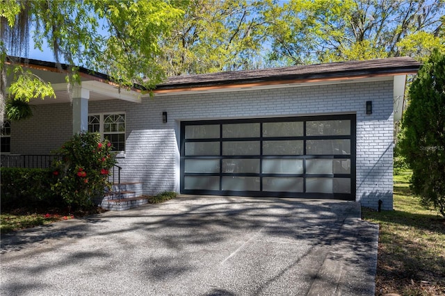 garage featuring driveway