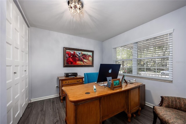 home office featuring baseboards, a notable chandelier, and dark wood-style flooring