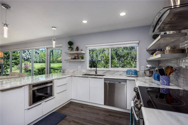 kitchen with open shelves, stainless steel appliances, modern cabinets, and a sink