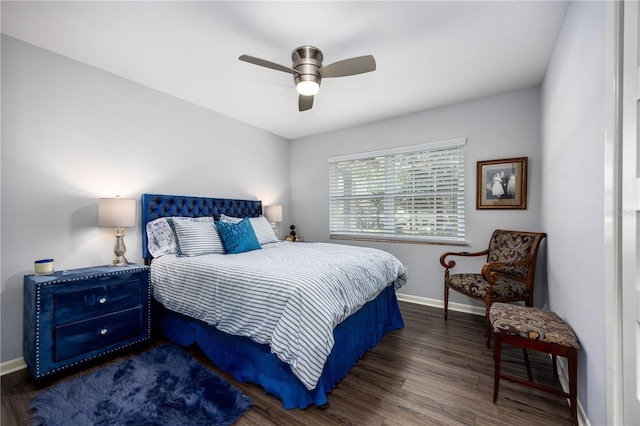 bedroom featuring ceiling fan, baseboards, and wood finished floors