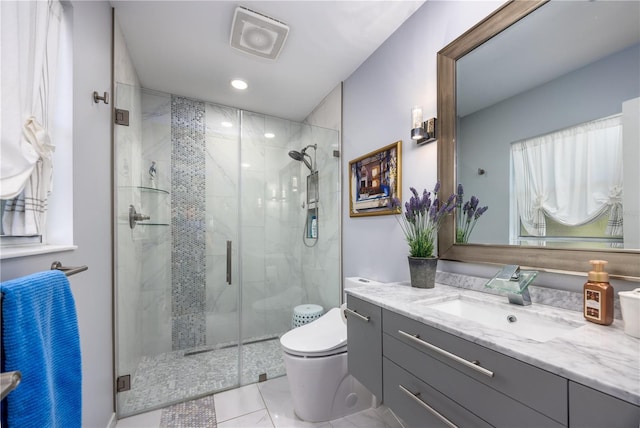 bathroom with recessed lighting, toilet, a stall shower, and vanity