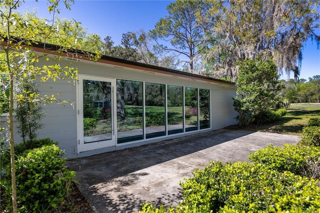 view of property exterior with a patio