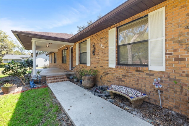 exterior space featuring brick siding