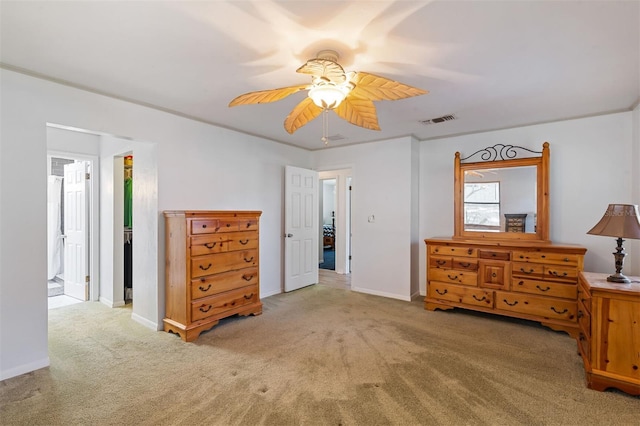 carpeted bedroom featuring visible vents, ceiling fan, and baseboards