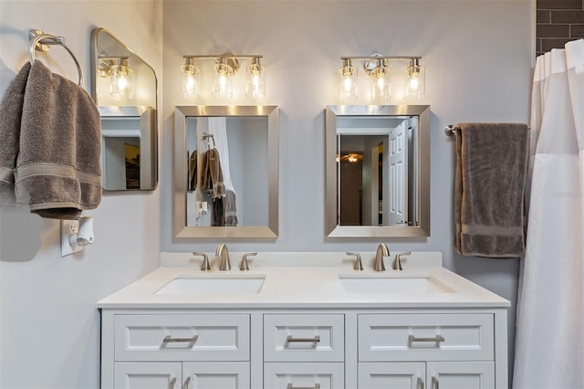 full bath with double vanity and a sink