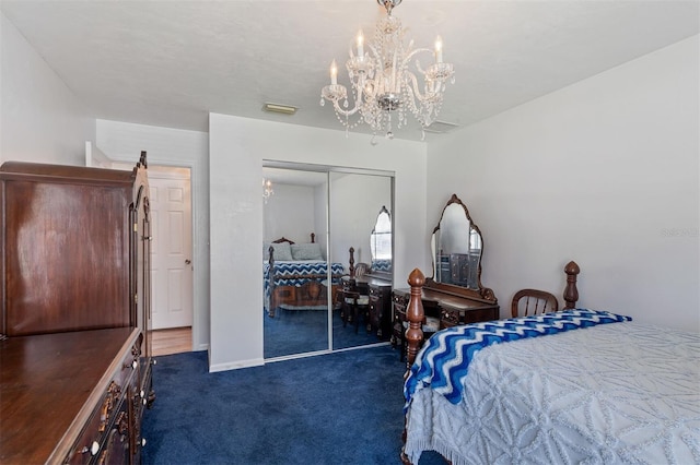 bedroom featuring carpet floors, a closet, visible vents, and a chandelier