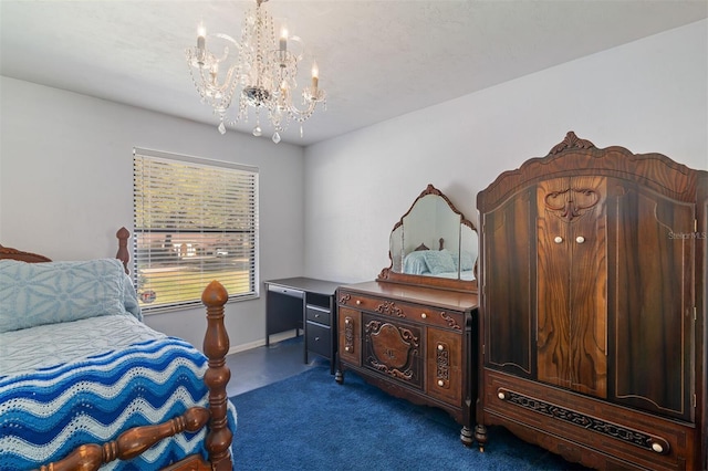 bedroom with dark carpet and a notable chandelier