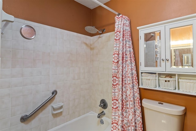 bathroom featuring toilet and shower / bath combo with shower curtain