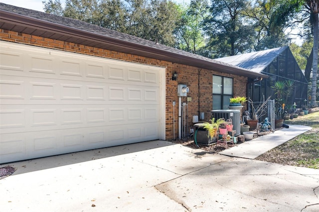 exterior space featuring driveway and central AC unit