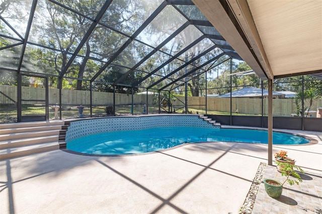 view of pool featuring a fenced backyard and a patio