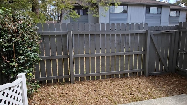 view of gate featuring fence