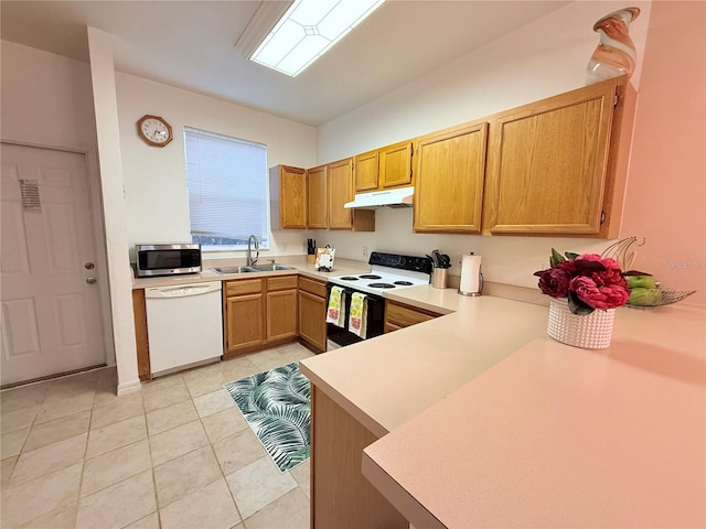 kitchen with electric stove, stainless steel microwave, white dishwasher, under cabinet range hood, and a sink