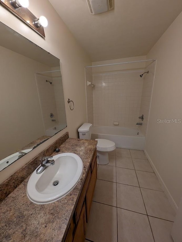 bathroom with tile patterned flooring, toilet, visible vents, vanity, and shower / washtub combination