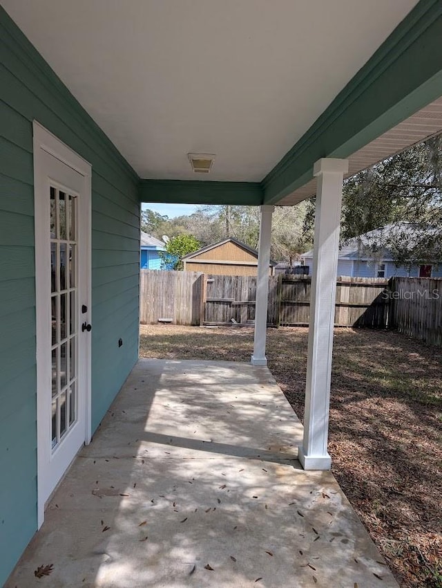 view of patio featuring fence