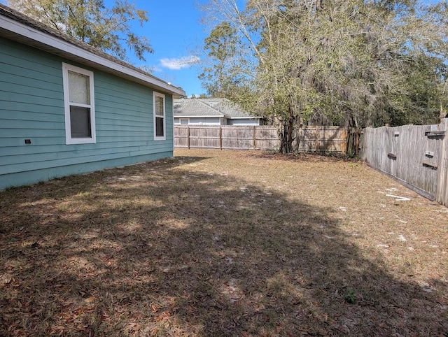 view of yard featuring a fenced backyard